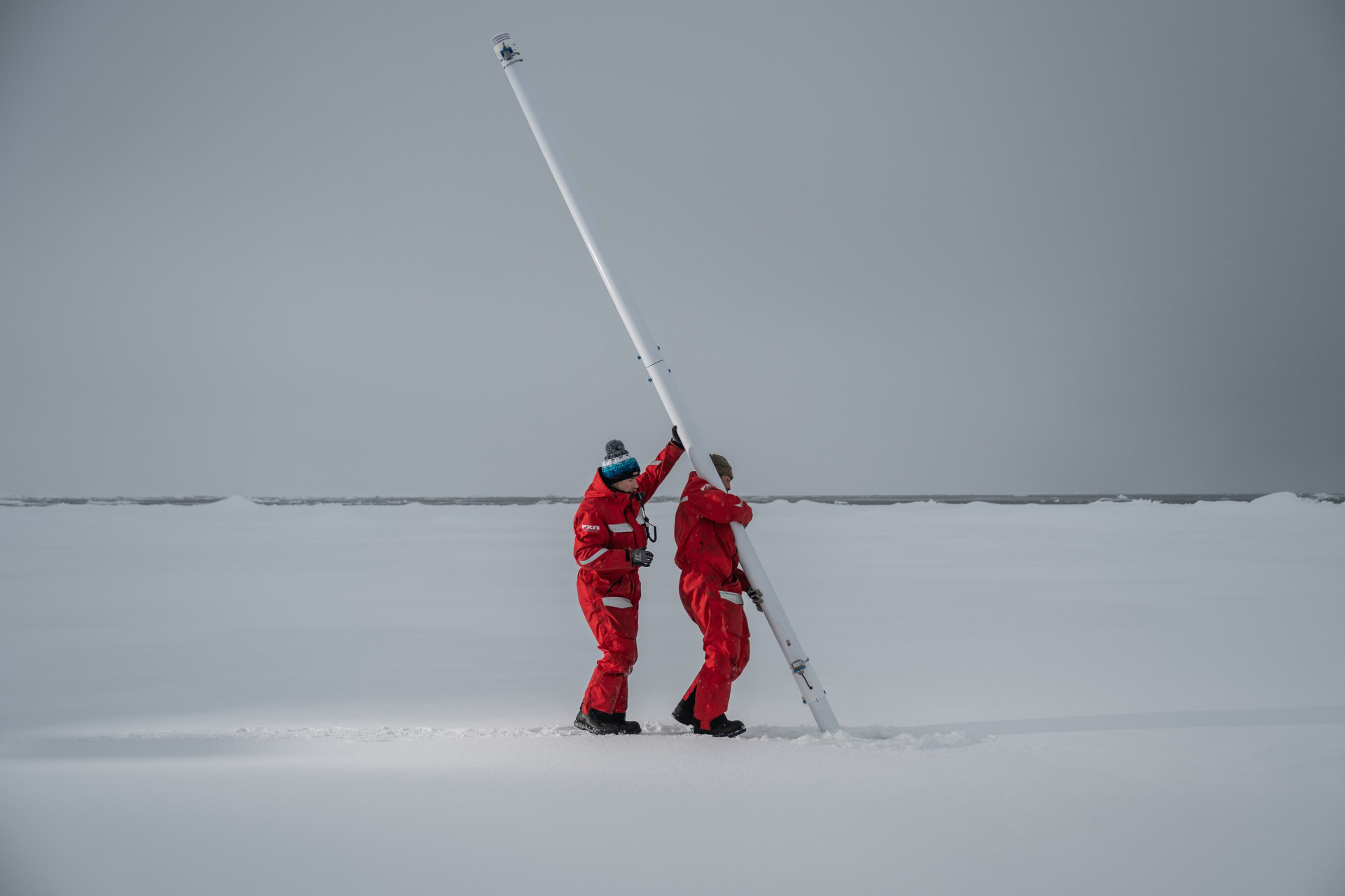 People raising a pole