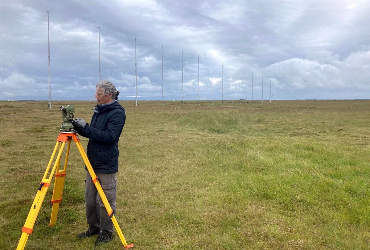 Professor Simon Shepherd checks the theodolite