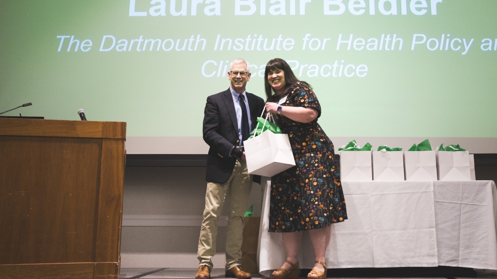 Laura Beidler receiving an award from Duane Compton