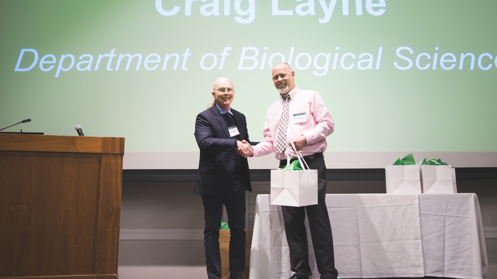 C. Robert McClung congratulating Craig Layne