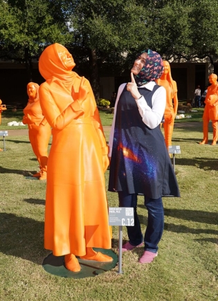 Burçin Mutlu-Pakdil alongside her 3D-printed statue
